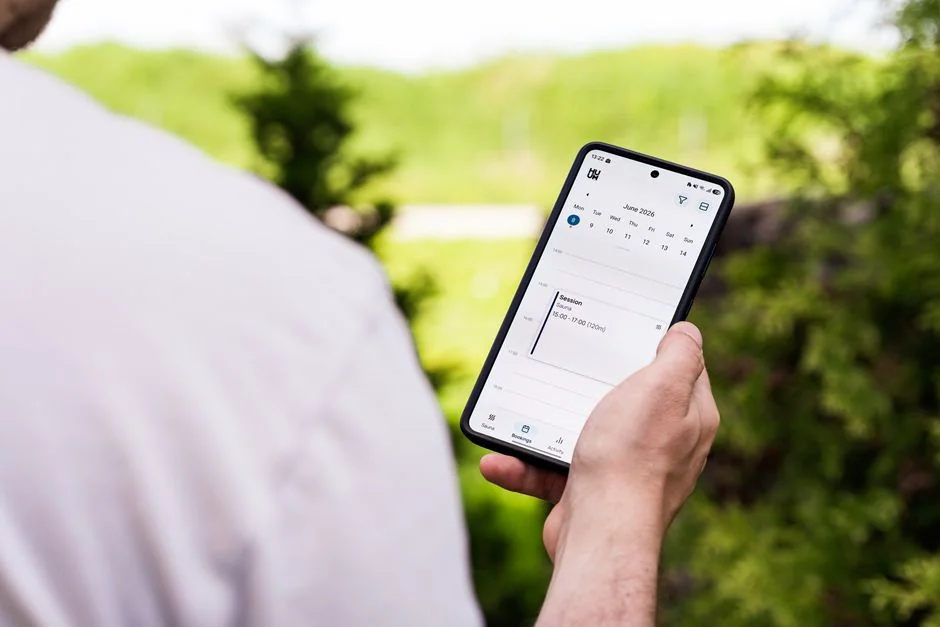 A tablet display showing minimalist decor images that highlight greenery and clean, simple design.
